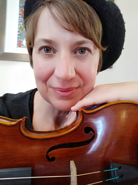 Laura holding a viola